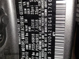 2013 Kia Sorento EX z VIN 5XYKUDA21DG411766, wystawiony jako Copart lot #55960765 z przebiegiem 159 584 mil mil oraz Szkoda całkowita • Salvage title. Historia ofert i sprzedaży dostępna na DreamBid. Obrazek 13.