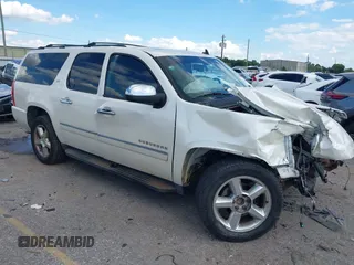 2014 Chevrolet Suburban LTZ with VIN 1GNSCKE08ER150520, listed as a IAAI auction lot 42236005 with 215,013 mi miles and . Bid and sale history available at DreamBid. Image 1.