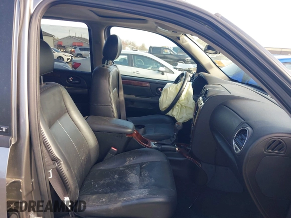 2005 GMC Envoy SLE with VIN 1GKDT13S852362380, listed as a IAAI auction lot 42031727 with 76,711 mi miles. Bid and sale history available at carsss.com. Image 5.