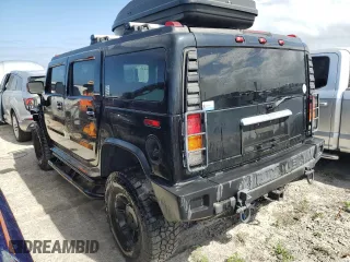 2003 Hummer H2 with VIN 5GRGN23U33H114427, listed as a Copart auction lot 76528834 with 133,571 mi miles and Salvage Title. Bid and sale history available at carsss.com. Image 2.