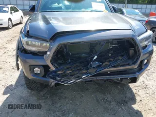2023 Toyota Tacoma SR with VIN 3TMCZ5AN9PM553246, listed as a IAAI auction lot 42201812 with 20,907 mi miles and . Bid and sale history available at DreamBid. Image 6.