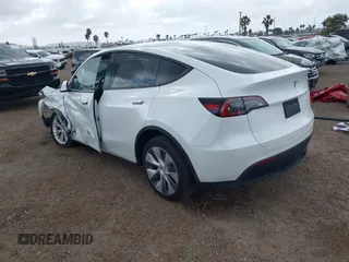2023 Tesla Model Y Long Range with VIN 7SAYGDEE6PA064162, listed as a IAAI auction lot 41533464 with 24,337 mi miles. Bid and sale history available at carsss.com. Image 3.