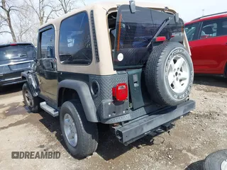 2002 Jeep Wrangler Sport with VIN 1J4FA49S62P743771, listed as a IAAI auction lot 41791205 with 186,622 mi miles. Bid and sale history available at carsss.com. Image 3.