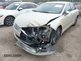 2014 Lincoln MKZ z VIN 3LN6L2JK7ER821385, wystawiony jako IAAI lot #42114154 z przebiegiem 141 480 mil mil oraz . Historia ofert i sprzedaży dostępna na DreamBid. Obrazek 6.