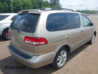 2001 Toyota Sienna LE with VIN 4T3ZF13C01U325889, listed as a IAAI auction lot 42795570 with 211,585 mi miles and . Bid and sale history available at DreamBid. Image 4.