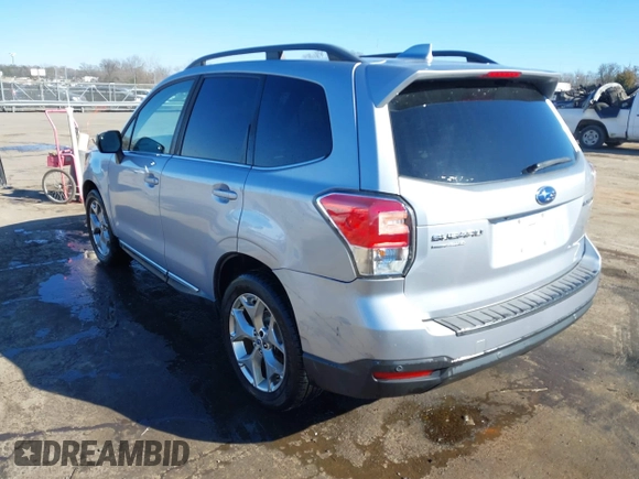 2017 Subaru Forester Touring with VIN JF2SJAWC8HH532348, listed as a IAAI auction lot 41304804 with 104,221 mi miles and . Bid and sale history available at DreamBid. Image 3.