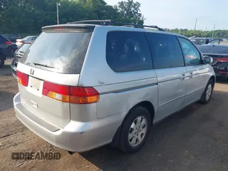 2003 Honda Odyssey EX-L with VIN 5FNRL18913B061340, listed as a IAAI auction lot 42633790 with 1,281,195 mi miles and . Bid and sale history available at DreamBid. Image 4.