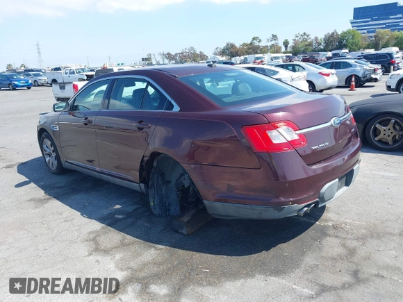 2011 Ford Taurus SEL with VIN 1FAHP2EW8BG137937, listed as a IAAI auction lot 42107586 with 143,525 mi miles. Bid and sale history available at carsss.com. Image 3.
