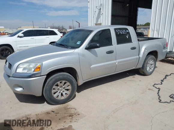 2006 Mitsubishi Raider LS z VIN 1Z7HT28KX6S576515, wystawiony jako IAAI lot #42180535 z przebiegiem 169 922 mil mil oraz . Historia ofert i sprzedaży dostępna na DreamBid. Obrazek 2.