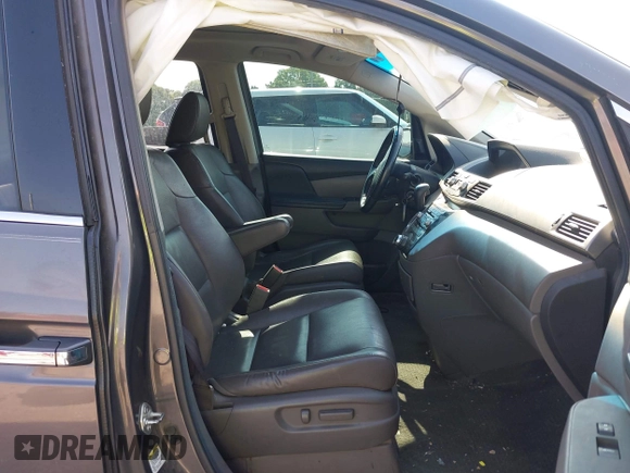 2013 Honda Odyssey Touring with VIN 5FNRL5H98DB080296, listed as a IAAI auction lot 42461843 with 104,901 mi miles and . Bid and sale history available at DreamBid. Image 5.