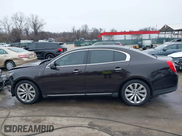 2014 Lincoln MKS with VIN 1LNHL9EK7EG609329, listed as a IAAI auction lot 41555819 with 89,849 mi miles. Bid and sale history available at carsss.com. Image 14.
