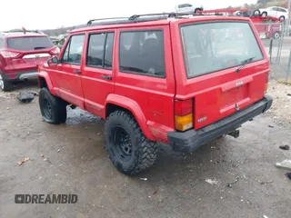 1996 Jeep Cherokee Sport with VIN 1J4FJ68S6TL299152, listed as a IAAI auction lot 41004736 with 277,819 mi miles. Bid and sale history available at carsss.com. Image 3.