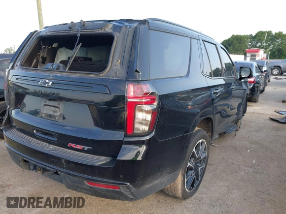 2024 Chevrolet Tahoe RST with VIN 1GNSCRKDXRR145972, listed as a IAAI auction lot 42216403 with 30,952 mi miles and . Bid and sale history available at DreamBid. Image 4.