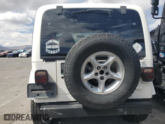 2000 Jeep Wrangler Sahara with VIN 1J4FA59S6YP790541, listed as a Copart auction lot 53837885 with 137,827 mi miles and Salvage title. Bid and sale history available at DreamBid. Image 6.