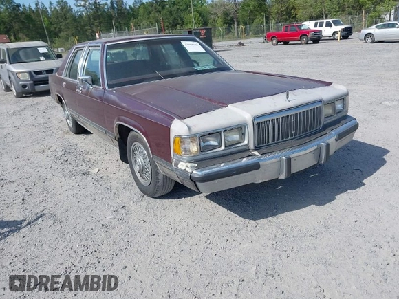 1990 Mercury Grand Marquis z VIN 2MECM74F9LX614526, wystawiony jako IAAI lot #42068697 z przebiegiem 4 875 mil mil oraz . Historia ofert i sprzedaży dostępna na DreamBid. Obrazek 1.