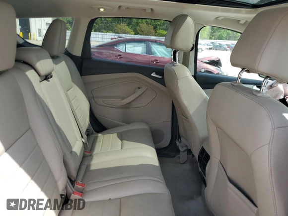 2016 Ford Escape Titanium with VIN 1FMCU9J94GUB31594, listed as a Copart auction lot 51690565 with 119,699 mi miles and Salvage Title. Bid and sale history available at DreamBid. Image 11.