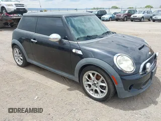 2007 MINI Hardtop S with VIN WMWMF735X7TT81426, listed as a IAAI auction lot 42815557 with 137,856 mi miles and . Bid and sale history available at DreamBid. Image 1.