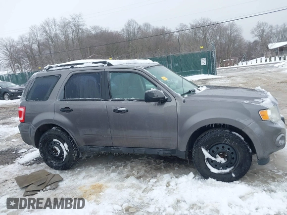 2012 Ford Escape XLS z VIN 1FMCU9C72CKA10130, wystawiony jako IAAI lot #41543233 z przebiegiem 168 552 mil mil oraz . Historia ofert i sprzedaży dostępna na DreamBid. Obrazek 13.