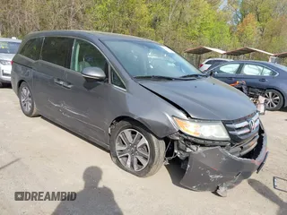 2014 Honda Odyssey Touring with VIN 5FNRL5H92EB073085, listed as a IAAI auction lot 42065913 with 120,834 mi miles and . Bid and sale history available at DreamBid. Image 1.