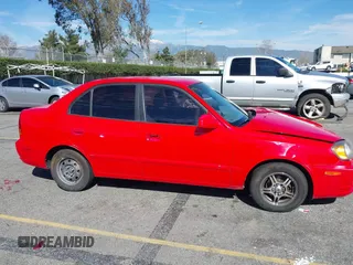 2003 Hyundai Accent GL with VIN KMHCG45C93U487209, listed as a IAAI auction lot 41590636 with 118,811 mi miles. Bid and sale history available at carsss.com. Image 13.