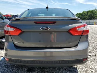 2012 Ford Focus SE z VIN 1FAHP3F23CL328787, wystawiony jako Copart lot #63186125 z przebiegiem 198 629 mil mil oraz Szkoda całkowita • Salvage title. Historia ofert i sprzedaży dostępna na DreamBid. Obrazek 6.