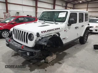 2021 Jeep Wrangler Unlimited Rubicon with VIN 1C4HJXFN2MW809904, listed as a IAAI auction lot 41567956 with 34,000 mi miles and . Bid and sale history available at DreamBid. Image 2.