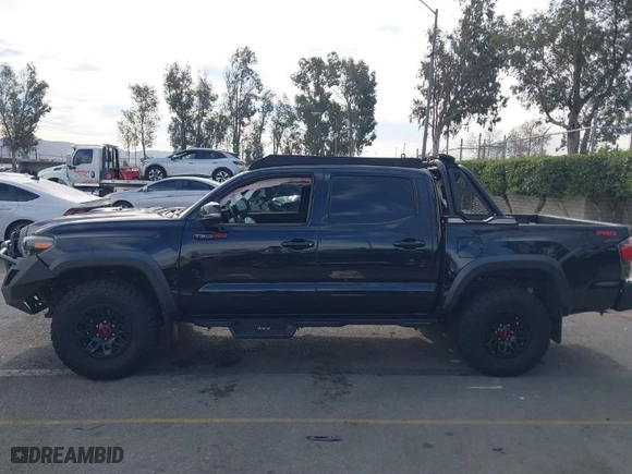 2019 Toyota Tacoma 4WD SR with VIN 5TFCZ5AN5KX193668, listed as a IAAI auction lot 41248429 with 60,812 mi miles. Bid and sale history available at carsss.com. Image 14.