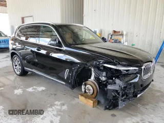 2023 BMW X5 sDrive40i with VIN 5UXCR4C05P9R70324, listed as a Copart auction lot 54661245 with 13,136 mi miles and Salvage title. Bid and sale history available at DreamBid. Image 4.