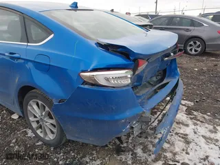 2019 Ford Fusion Hybrid SE with VIN 3FA6P0LUXKR131563, listed as a IAAI auction lot 41448736 with 165,440 mi miles. Bid and sale history available at carsss.com. Image 6.