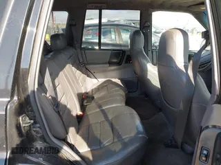 1995 Jeep Grand Cherokee Laredo z VIN 1J4GZ58S9SC553345, wystawiony jako IAAI lot #42772979 z przebiegiem 216 808 mil mil oraz . Historia ofert i sprzedaży dostępna na DreamBid. Obrazek 8.