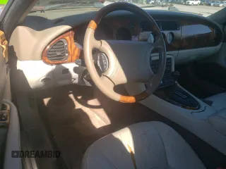 1999 Jaguar XK z VIN SAJGX2043XC032962, wystawiony jako Copart lot #49312155 z przebiegiem 74 662 mil mil oraz Szkoda całkowita • Salvage title. Historia ofert i sprzedaży dostępna na DreamBid. Obrazek 8.