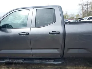 2023 Toyota Tundra with VIN 5TFKB5GDXPX002218, listed as a IAAI auction lot 41932719 with 71,335 mi miles and . Bid and sale history available at DreamBid. Image 14.