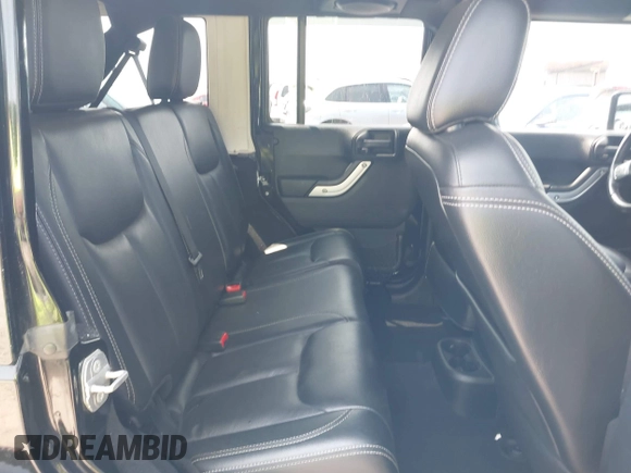 2014 Jeep Wrangler Unlimited Sahara with VIN 1C4BJWEG0EL273086, listed as a IAAI auction lot 42340938 with 121,448 mi miles and . Bid and sale history available at DreamBid. Image 8.