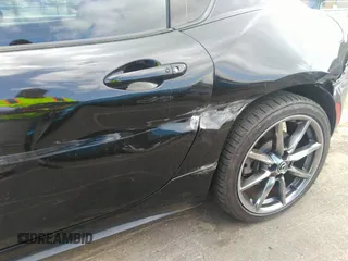 2021 Mazda MX-5 Miata Grand Touring z VIN JM1NDAM75M0451597, wystawiony jako IAAI lot #41932712 z przebiegiem 61 710 mil mil oraz . Historia ofert i sprzedaży dostępna na DreamBid. Obrazek 18.