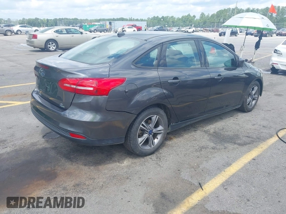 2018 Ford Focus SE with VIN 1FADP3FE2JL263954, listed as a IAAI auction lot 42480748 with 111,059 mi miles and . Bid and sale history available at DreamBid. Image 4.