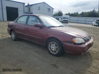 2003 Kia Spectra with VIN KNAFB121935241589, listed as a Copart auction lot 71933194 with 61,738 mi miles and Salvage Title. Bid and sale history available at carsss.com. Image 4.