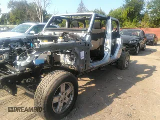 2022 Jeep Gladiator Willys with VIN 1C6HJTAG0NL131004, listed as a IAAI auction lot 40307060 with Not provided miles and . Bid and sale history available at DreamBid. Image 2.
