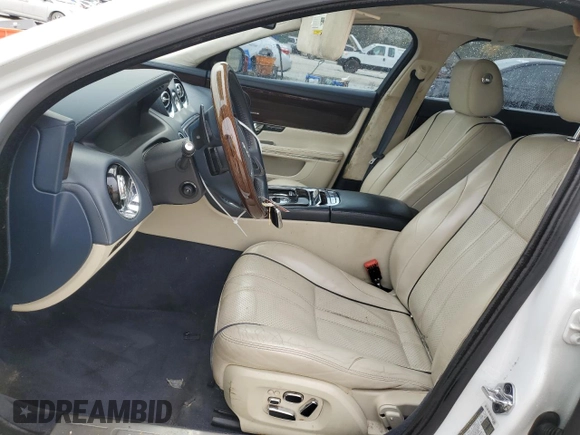 2013 Jaguar XJ with VIN SAJWA2GB8DLV52975, listed as a Copart auction lot 79123644 with 160,473 mi miles and Salvage Title. Bid and sale history available at carsss.com. Image 7.