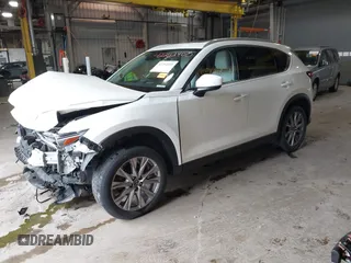 2020 Mazda CX-5 Grand Touring with VIN JM3KFADMXL0742038, listed as a IAAI auction lot 42292400 with 68,339 mi miles and . Bid and sale history available at DreamBid. Image 23.