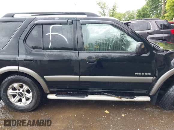 2003 Isuzu Rodeo with VIN 4S2DM58W234312253, listed as a IAAI auction lot 42319453 with 187,939 mi miles and . Bid and sale history available at DreamBid. Image 13.