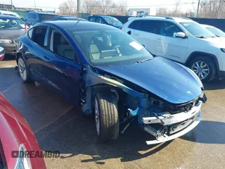 2021 Tesla Model 3 Long Range with VIN 5YJ3E1EB6MF990089, listed as a IAAI auction lot 41607316 with 25,223 mi miles and . Bid and sale history available at DreamBid. Image 1.