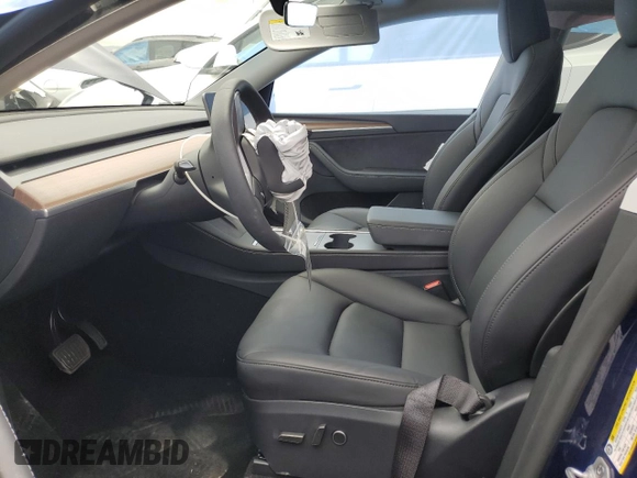 2024 Tesla Model Y Long Range with VIN 7SAYGDEE0RF176672, listed as a Copart auction lot 55622355 with 6,728 mi miles and Salvage title. Bid and sale history available at DreamBid. Image 7.