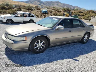 2000 Cadillac Seville Touring STS z VIN 1G6KY5498YU255607, wystawiony jako Copart lot #71130714 z przebiegiem 146 046 mil mil oraz Szkody całkowita. Historia ofert i sprzedaży dostępna na DreamBid. Obrazek 1.
