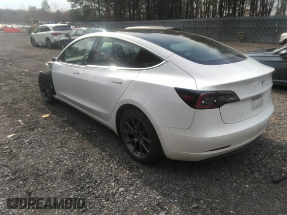 2020 Tesla Model 3 Standard Range Plus with VIN 5YJ3E1EA4LF792830, listed as a IAAI auction lot 41852919 with 76,461 mi miles. Bid and sale history available at carsss.com. Image 3.