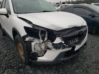 2014 Mazda CX-5 Touring z VIN JM3KE4CY1E0406726, wystawiony jako Copart lot #54652065 z przebiegiem 245 491 mil mil oraz Szkoda całkowita • Salvage title. Historia ofert i sprzedaży dostępna na DreamBid. Obrazek 13.