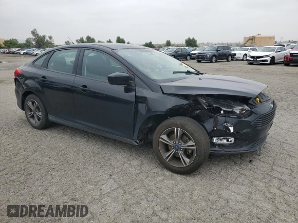2018 Ford Focus SE with VIN 1FADP3FE8JL300246, listed as a Copart auction lot 59585035 with 83,141 mi miles and Salvage title. Bid and sale history available at DreamBid. Image 4.