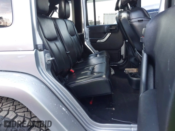 2015 Jeep Wrangler Unlimited Rubicon Hard Rock with VIN 1C4HJWFG1FL659803, listed as a IAAI auction lot 41172485 with 126,881 mi miles and . Bid and sale history available at DreamBid. Image 8.