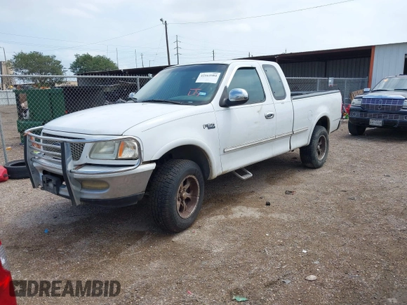 1997 Ford F-150 XL z VIN 1FTEX18L0VNB99499, wystawiony jako IAAI lot #42163584 z przebiegiem 242 946 mil mil oraz . Historia ofert i sprzedaży dostępna na DreamBid. Obrazek 2.