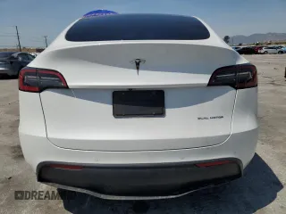 2022 Tesla Model Y Long Range z VIN 7SAYGDEE2NF513823, wystawiony jako Copart lot #51174795 z przebiegiem 28 143 mil mil oraz Szkody całkowita. Historia ofert i sprzedaży dostępna na DreamBid. Obrazek 6.
