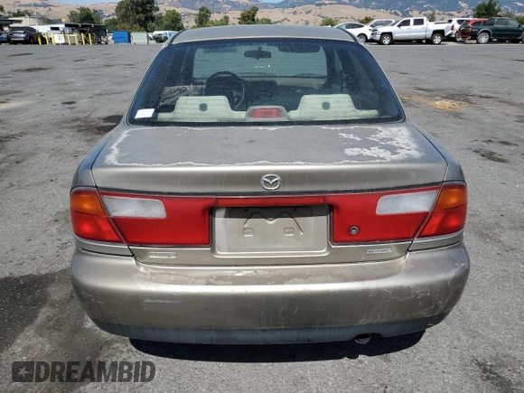 1998 Mazda Protege DX z VIN JM1BC1414W0203670, wystawiony jako Copart lot #62966544 z przebiegiem 249 405 mil mil oraz Szkoda całkowita • Salvage title. Historia ofert i sprzedaży dostępna na DreamBid. Obrazek 6.